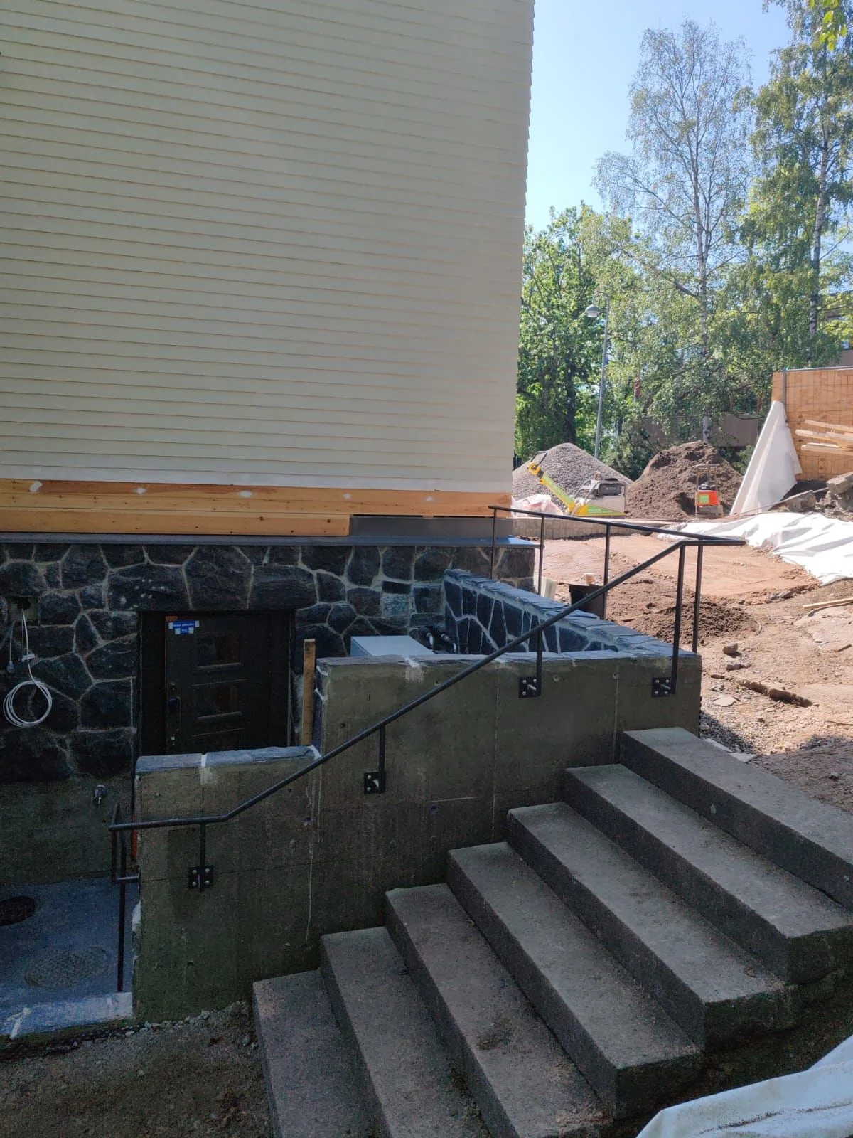 An outdoor stair railing alongside the museum building.