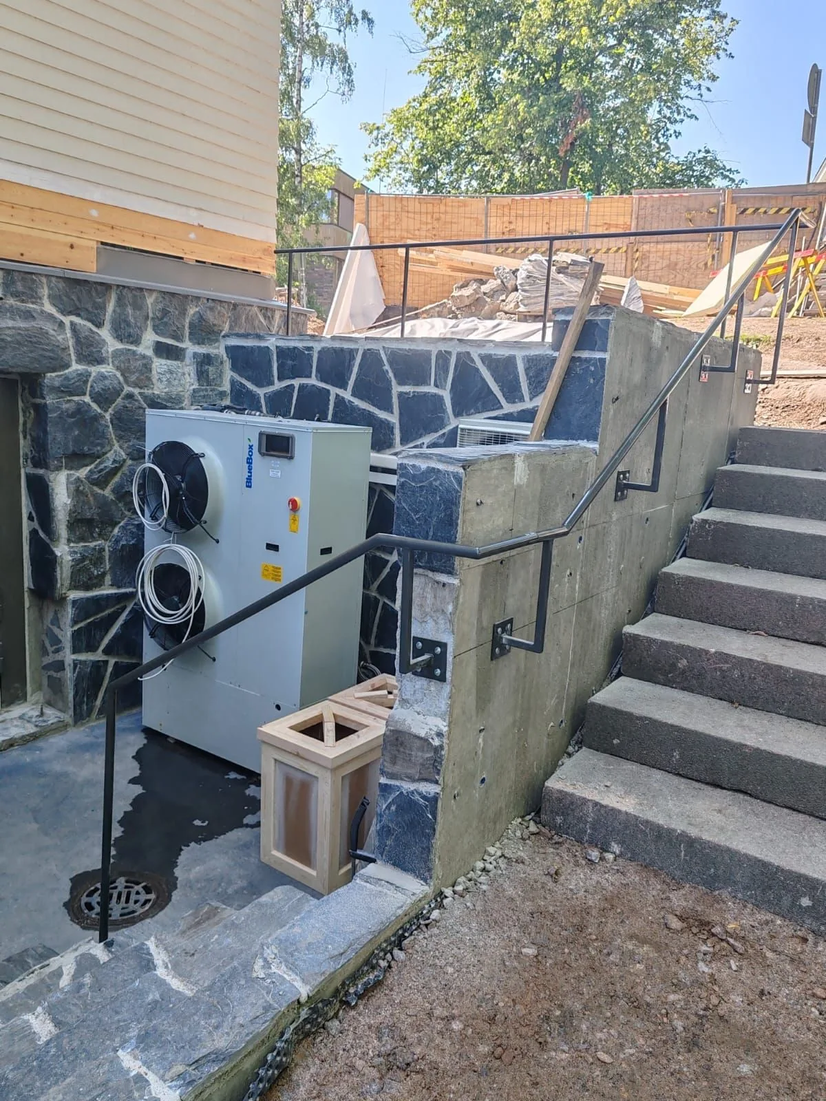 Stairs, railings and building services in the museum courtyard.