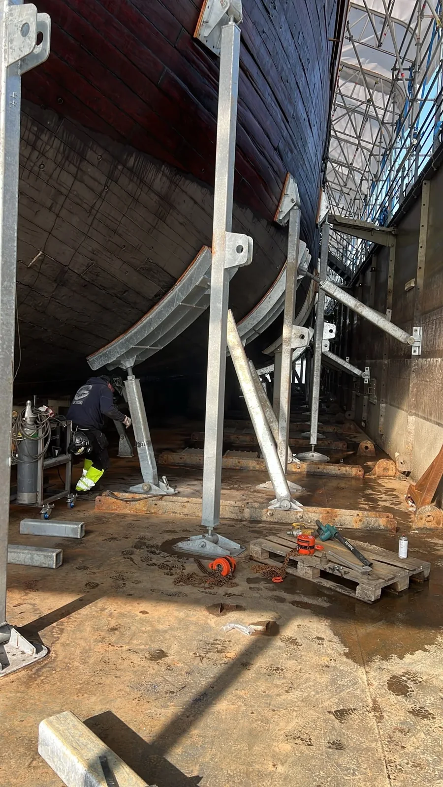 Steel structures supporting Sigyn’s hull in the docking facility.