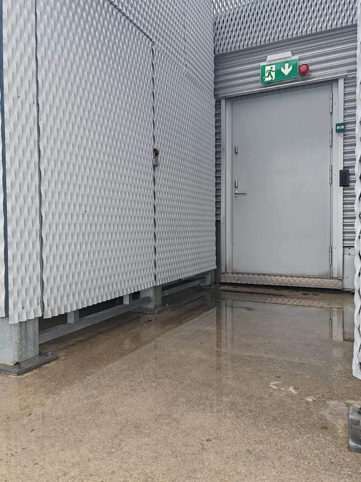 An exit door and the surrounding mesh structure.